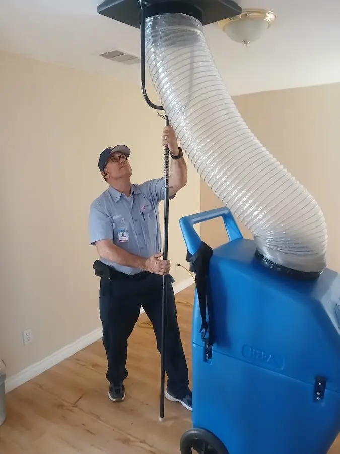 Furnace Tune-Up technician using HEPA equipment in Pascagoula